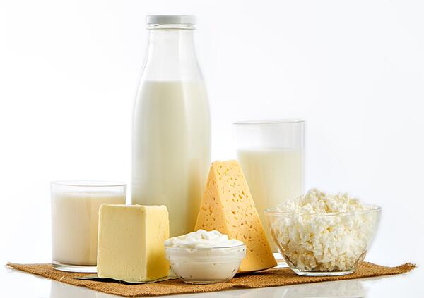 What is milk standardization and why is it needed?